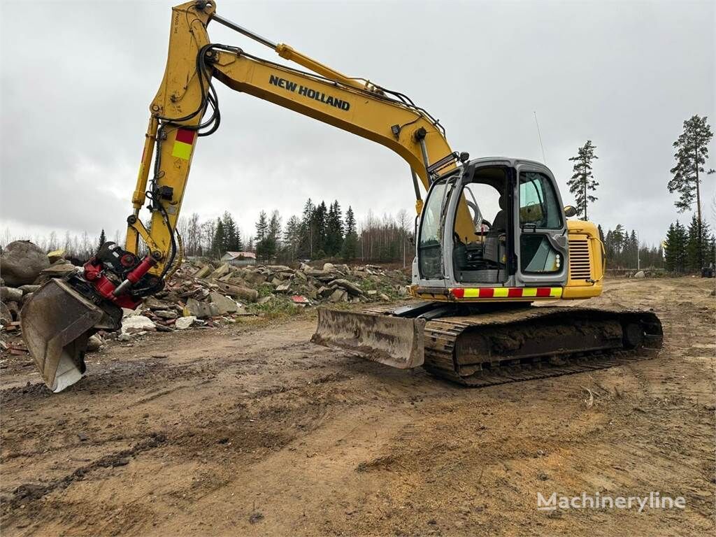 New Holland E 135 SR 1-ES bager guseničar